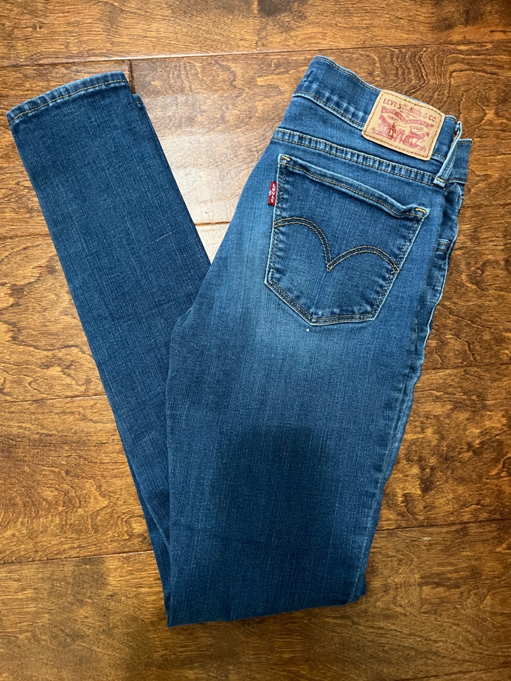 Levi's Women's 710 Super Skinny Jeans in Medium Blue Denim with Red Tab